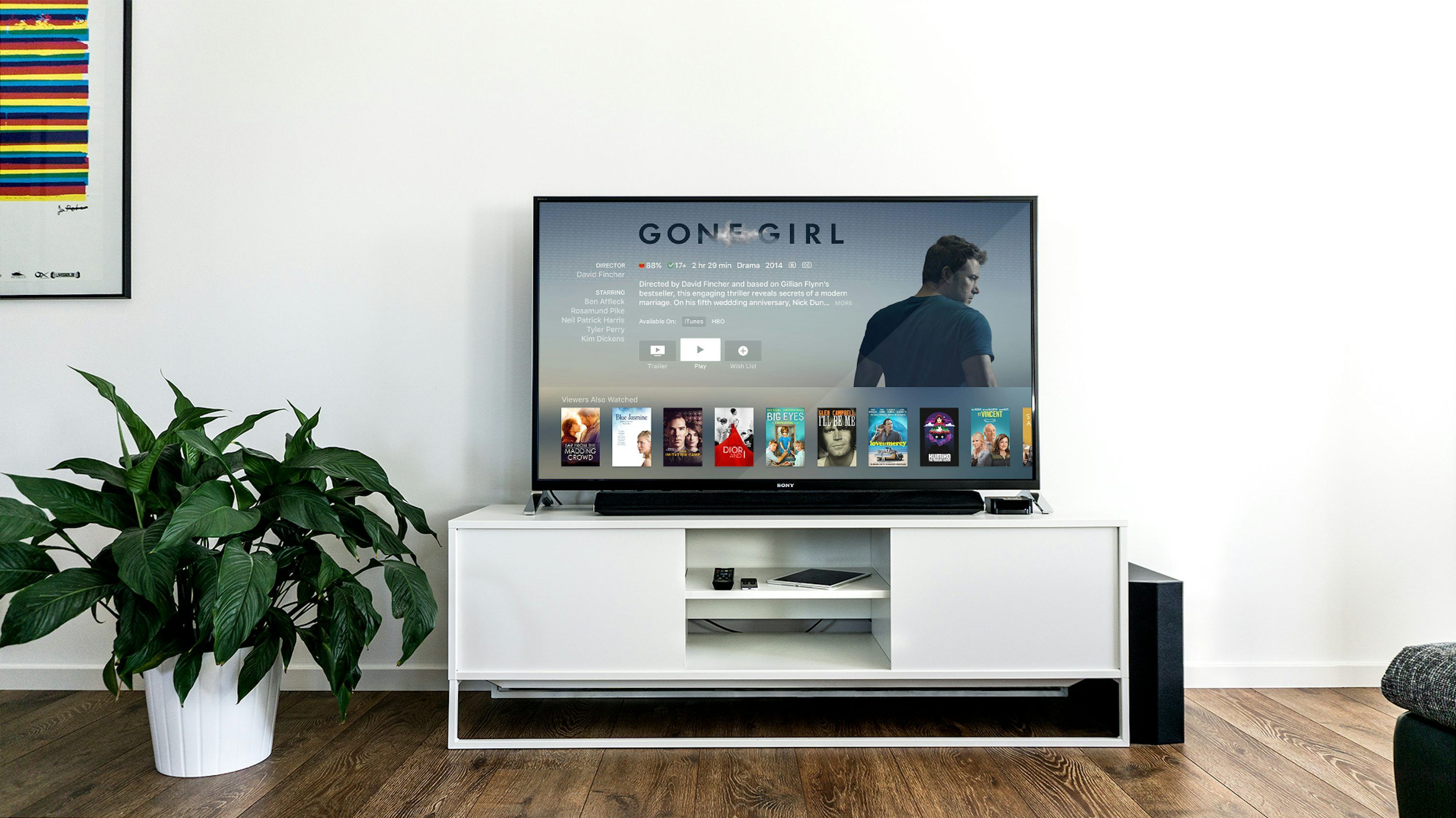 Person setting up IPTV lifetime subscription on a Fire TV Stick connected to a flat screen TV