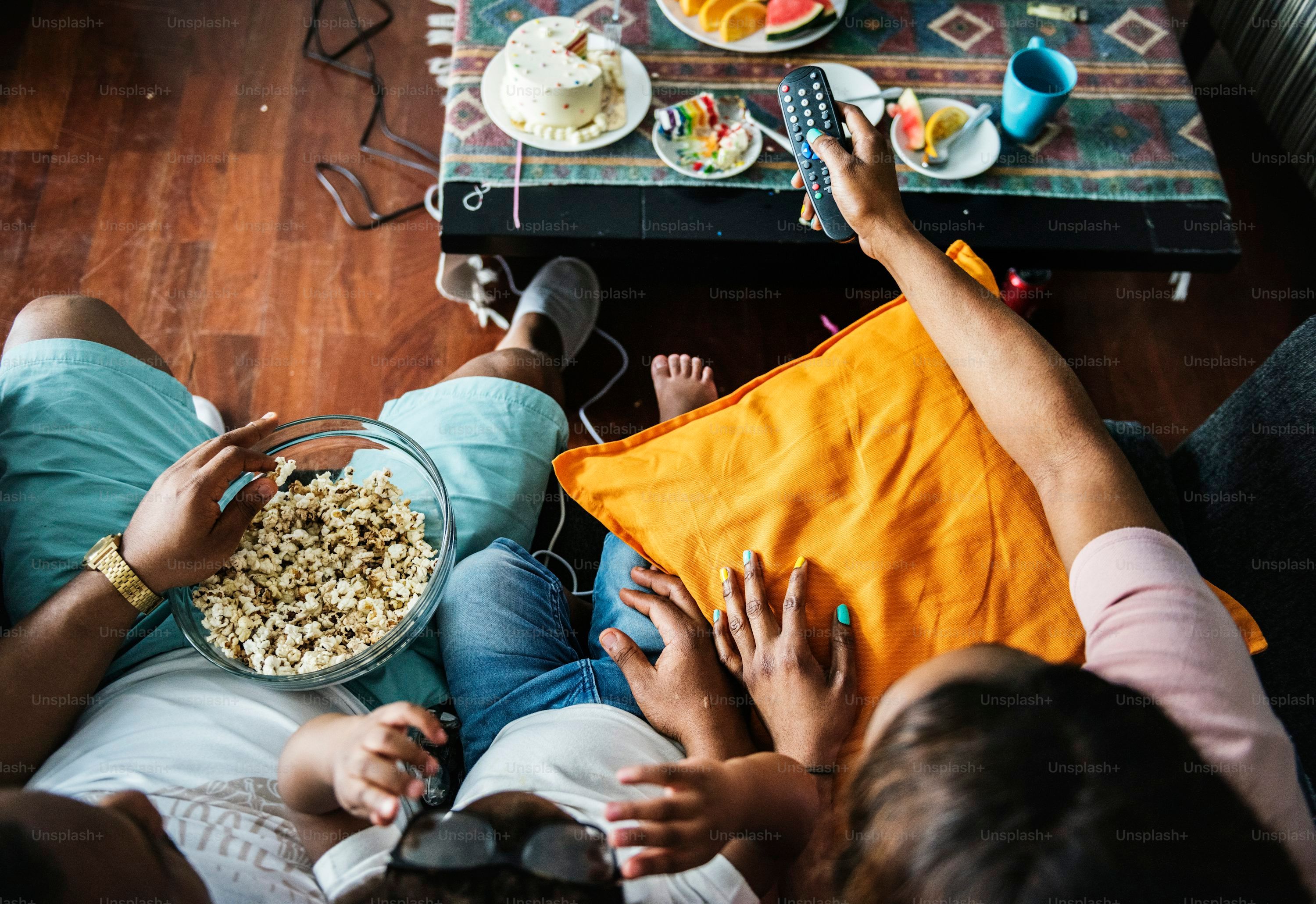 Customer receiving 24/7 IPTV support on a smartphone while watching TV at home