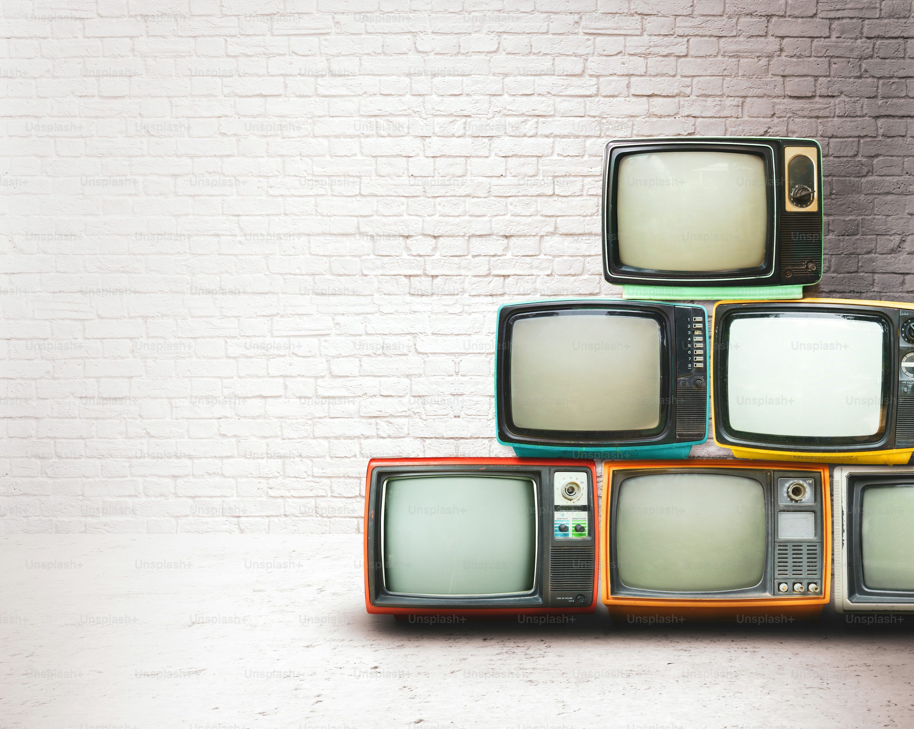 Person relaxing and enjoying IPTV lifetime subscription streaming on a widescreen television
